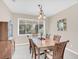 Formal dining room with hardwood floors and large windows at 4292 Lillian Hall Ln, Orlando, FL 32812