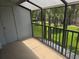 Enjoy the outdoors on this balcony with black rails overlooking manicured grass, shrubs, and palm trees at 4826 Marks Terrace # 389, Orlando, FL 32811
