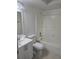 Well-lit bathroom with a white vanity and shower with tile at 4826 Marks Terrace # 389, Orlando, FL 32811