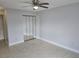Bright bedroom with ceiling fan and mirrored closet doors for extra space and convenience at 4826 Marks Terrace # 389, Orlando, FL 32811