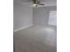 Neutral bedroom with ceiling fan, and window with blinds providing plenty of natural light at 4826 Marks Terrace # 389, Orlando, FL 32811