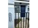 Close up of the front door to unit 4826 with address numbers and a black metal fence at 4826 Marks Terrace # 389, Orlando, FL 32811