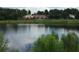 Picturesque lake view showcasing the serene water and lush landscaping at 4826 Marks Terrace # 389, Orlando, FL 32811