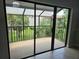 Screened lanai overlooking lush landscaping, perfect for outdoor relaxation and entertaining at 4826 Marks Terrace # 389, Orlando, FL 32811