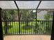 Relaxing screened lanai with views of tropical foliage and well-manicured lawns at 4826 Marks Terrace # 389, Orlando, FL 32811