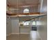 Open concept living room with natural light and wooden staircase at 4826 Marks Terrace # 389, Orlando, FL 32811