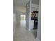 Open-concept living area with tile flooring, stairs, and a sliding glass door to the lanai at 4826 Marks Terrace # 389, Orlando, FL 32811