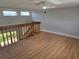 Loft area overlooking the living room, featuring wood floors and great natural light at 4826 Marks Terrace # 389, Orlando, FL 32811