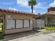 Mailbox cluster with tiled roof and mature palm in a well-maintained community at 4826 Marks Terrace # 389, Orlando, FL 32811