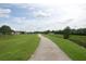 Scenic walking path winding through lush greenery, perfect for enjoying the outdoors at 4826 Marks Terrace # 389, Orlando, FL 32811