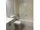 A bright bathroom with a white toilet and bathtub at 4828 Marks Terrace # 389, Orlando, FL 32811