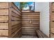 Private outdoor shower with wooden walls and bench at 507 Palmer St, Orlando, FL 32801