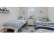Cozy ' bedroom with two twin beds, nautical themed decorations, and a window for natural light at 508 Zamora Way, Davenport, FL 33837