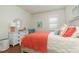 Well-lit bedroom with a comfortable bed, coastal decor, and a dresser at 508 Zamora Way, Davenport, FL 33837