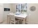 Cozy dining area with bright natural light highlighting the furnishings and decor at 508 Zamora Way, Davenport, FL 33837