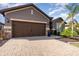 Beautiful single story home with manicured landscaping, a brick driveway and a two car garage at 508 Zamora Way, Davenport, FL 33837
