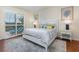 Serene main bedroom featuring a plush bed, stylish décor and access to the outdoor living area at 508 Zamora Way, Davenport, FL 33837