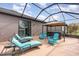Relaxing patio featuring lounge chairs, Adirondack seating, and a covered hot tub for outdoor enjoyment at 508 Zamora Way, Davenport, FL 33837