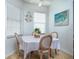 Bright dining area with a table for six and a view to kitchen at 5999 Lake Pointe # 609, Orlando, FL 32822