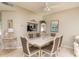 Formal dining room with a large table and six chairs at 5999 Lake Pointe # 609, Orlando, FL 32822