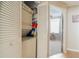 Stacked washer and dryer in a well-organized closet at 5999 Lake Pointe # 609, Orlando, FL 32822