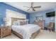 Relaxing main bedroom with king-size bed and light blue walls at 5999 Lake Pointe # 609, Orlando, FL 32822