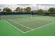 Two well-maintained tennis courts at 5999 Lake Pointe # 609, Orlando, FL 32822