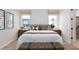 Cozy bedroom with wood floors and en-suite bathroom at 7345 Ivy Tendril Ave, Orlando, FL 32829