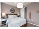 Neutral bedroom with a natural woven headboard at 7345 Ivy Tendril Ave, Orlando, FL 32829