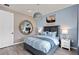 Blue and gray bedroom with a modern feel at 7345 Ivy Tendril Ave, Orlando, FL 32829