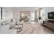 Living area featuring hardwood floors, a neutral color palette, and comfortable seating at 7345 Ivy Tendril Ave, Orlando, FL 32829