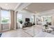 Open living space with hardwood floors and a view of the kitchen at 7345 Ivy Tendril Ave, Orlando, FL 32829