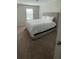 Bedroom with carpet flooring, large windows, and a queen sized bed at 8066 Glenlloyd Ave, Winter Garden, FL 34787