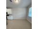 Bright dining area featuring a large window, neutral walls, and tile flooring, perfect for casual meals or entertaining at 8066 Glenlloyd Ave, Winter Garden, FL 34787
