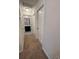 Hallway with carpet floors and access to the bathroom at 8066 Glenlloyd Ave, Winter Garden, FL 34787