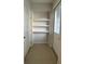 Mud room featuring tile floors, hooks, and built in shelving for storage at 8066 Glenlloyd Ave, Winter Garden, FL 34787