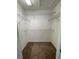Well-organized walk-in closet with carpet flooring and shelving for ample storage space in a modern home at 8066 Glenlloyd Ave, Winter Garden, FL 34787