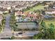 Aerial view of the community featuring pool, tennis courts, clubhouse and lush landscaping at 9573 Meadow Hunt Way, Winter Garden, FL 34787