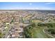 Expansive aerial shot of the community, showcasing the layout with nearby golf course, tennis courts and community pool at 9573 Meadow Hunt Way, Winter Garden, FL 34787