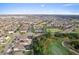 Expansive aerial shot of the community, showcasing the layout with nearby golf course, tennis courts and community pool at 9573 Meadow Hunt Way, Winter Garden, FL 34787