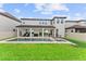 Expansive backyard with a modern pool, spa, and covered patio at 9573 Meadow Hunt Way, Winter Garden, FL 34787