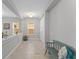 Bright foyer featuring tile floors, a bench, and natural light from nearby windows at 9573 Meadow Hunt Way, Winter Garden, FL 34787