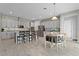 Beautiful kitchen with stainless steel appliances, an island with seating, eat in kitchen table and lots of natural light at 9573 Meadow Hunt Way, Winter Garden, FL 34787