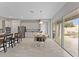 Open concept kitchen with eat in kitchen table and access to the backyard patio via sliding glass doors at 9573 Meadow Hunt Way, Winter Garden, FL 34787