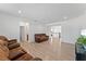 Expansive living area with hardwood floors and comfortable couches, creating a relaxing atmosphere at 9573 Meadow Hunt Way, Winter Garden, FL 34787