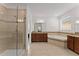 Luxurious main bathroom with glass shower, soaking tub, and double vanity at 9573 Meadow Hunt Way, Winter Garden, FL 34787