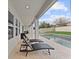 Backyard patio with a private pool and an outdoor lounge area with a covered seating area at 9573 Meadow Hunt Way, Winter Garden, FL 34787