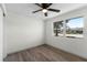 Bright bedroom featuring wood-look floors and a large window at 1021 Flagler Ave, Edgewater, FL 32132