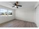 Well-lit bedroom with wood-look floors and ample closet space at 1021 Flagler Ave, Edgewater, FL 32132