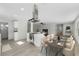 Renovated kitchen features island, stainless steel appliances, and dining area at 1021 Flagler Ave, Edgewater, FL 32132